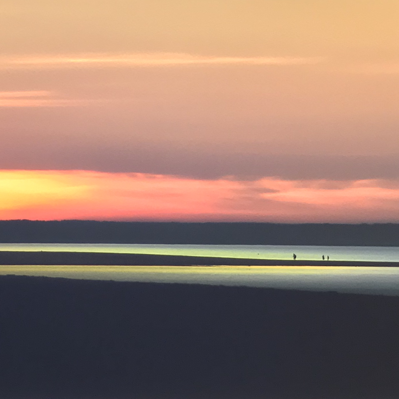 Sunset over a tidal beach, a photograph shown at Gallery 9